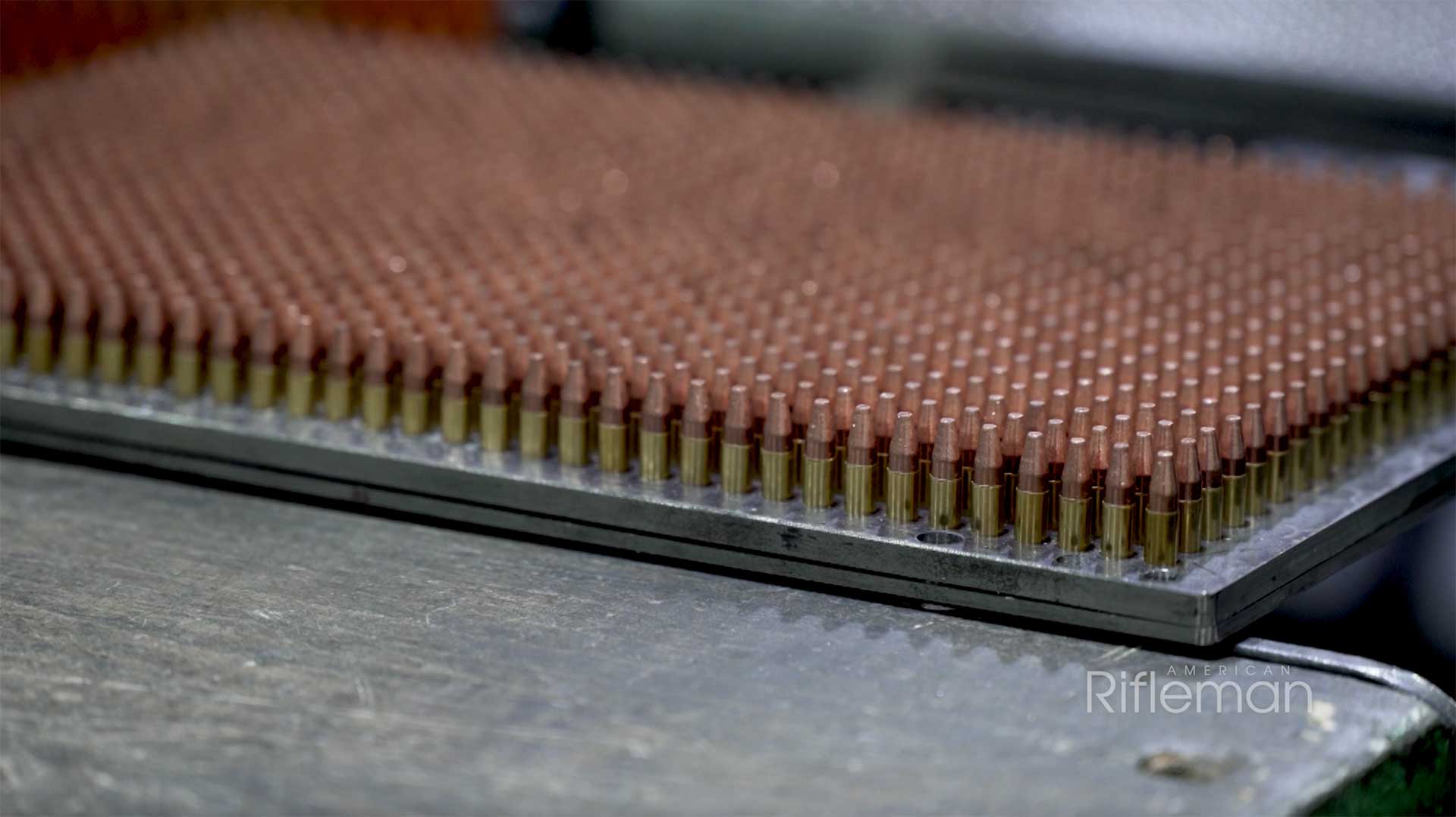 A loading tray filled with Winchester .21 Sharp cartridges.