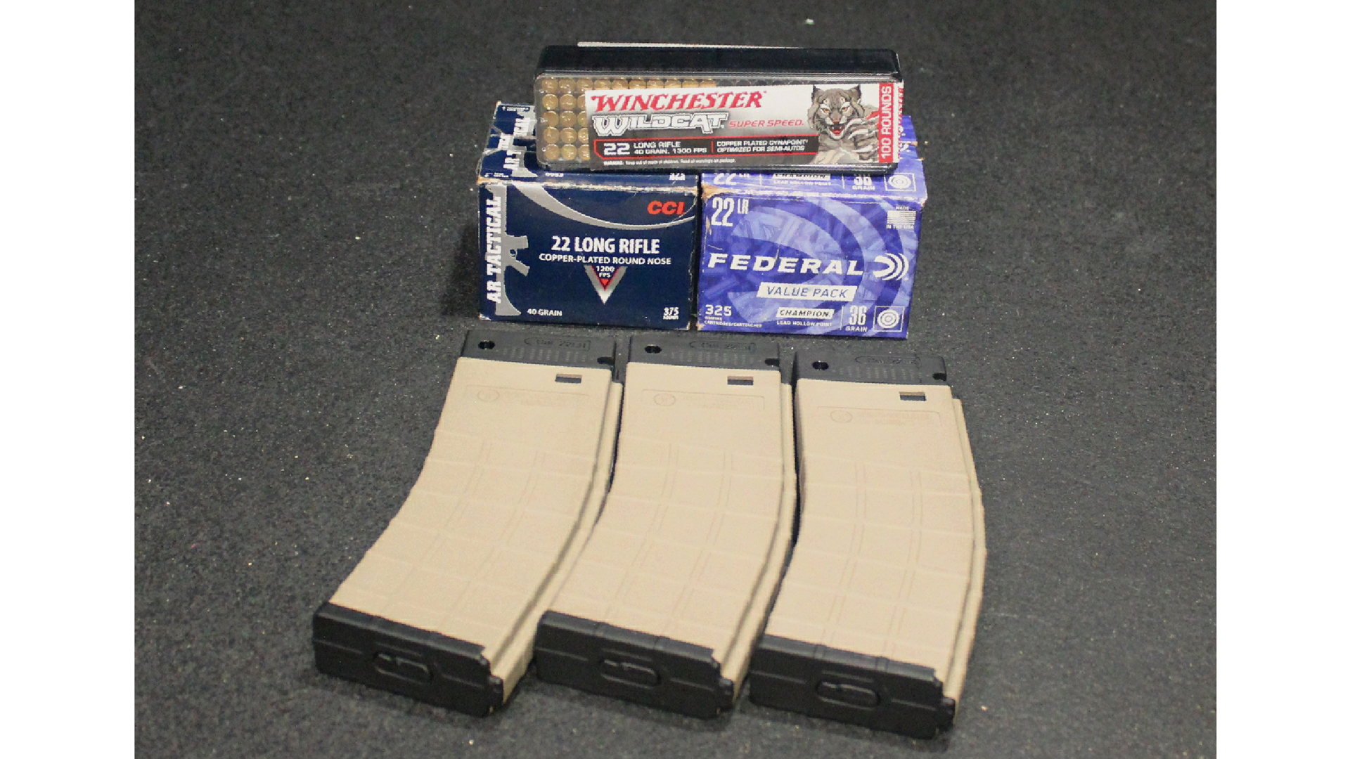 Tippmann M4-22 LTE magazines with ammunition boxes on table