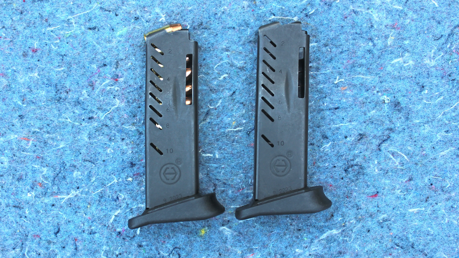 Hi-Point Firearms YC380 yeet cannon detachable box magazines two vertical arrangement side-by-side comarison view shown on speckled blue background