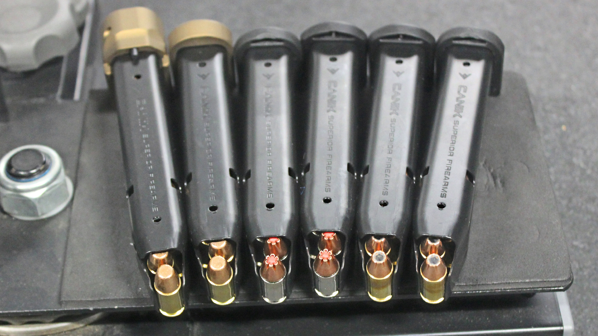 Six pistol handgun magazines row line ammunition
