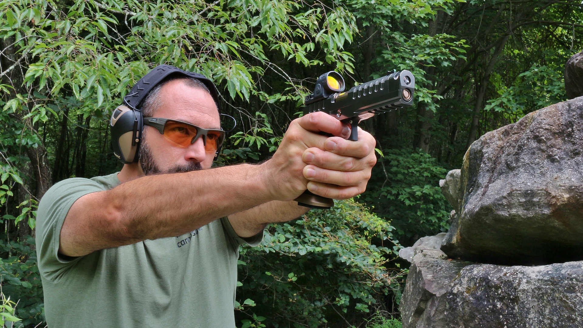 Man outdors shooting Watchtower Firearms Apache pistol double-stack m1911