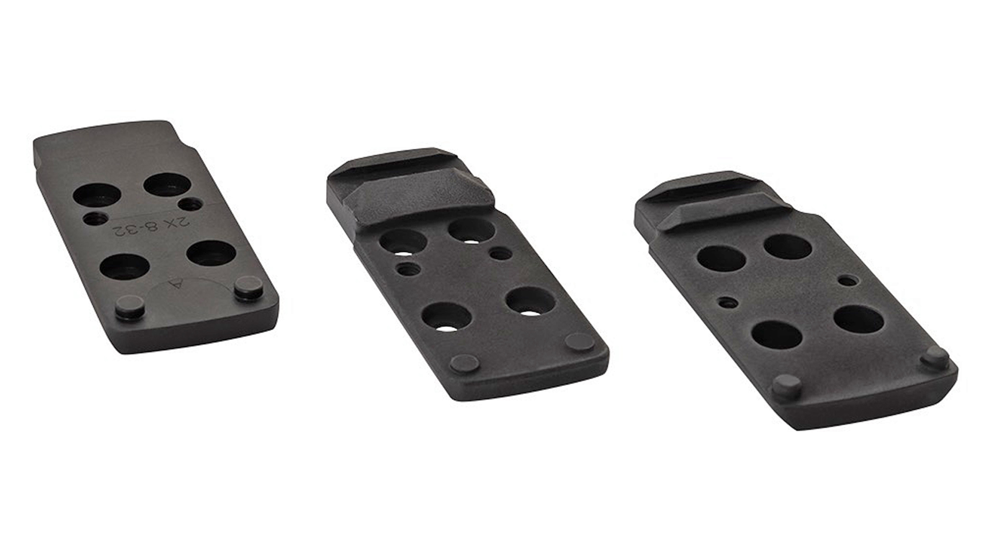 Three black optics mounting plates designed for the Colt Optics-Ready Competition 1911.