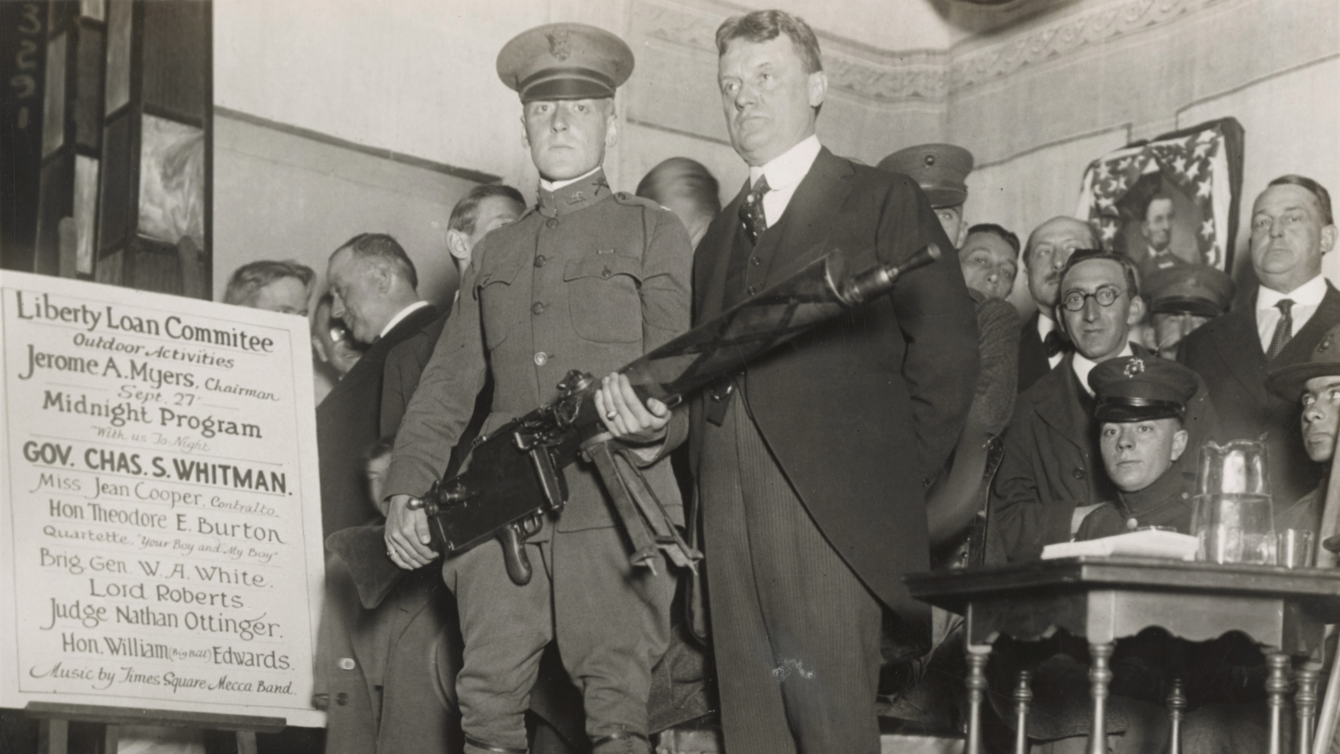 Liberty Loan incentive: A camouflaged MG08/15 war trophy displayed at war loan rally. New York Governor Charles Whitman is seen at right. NARA