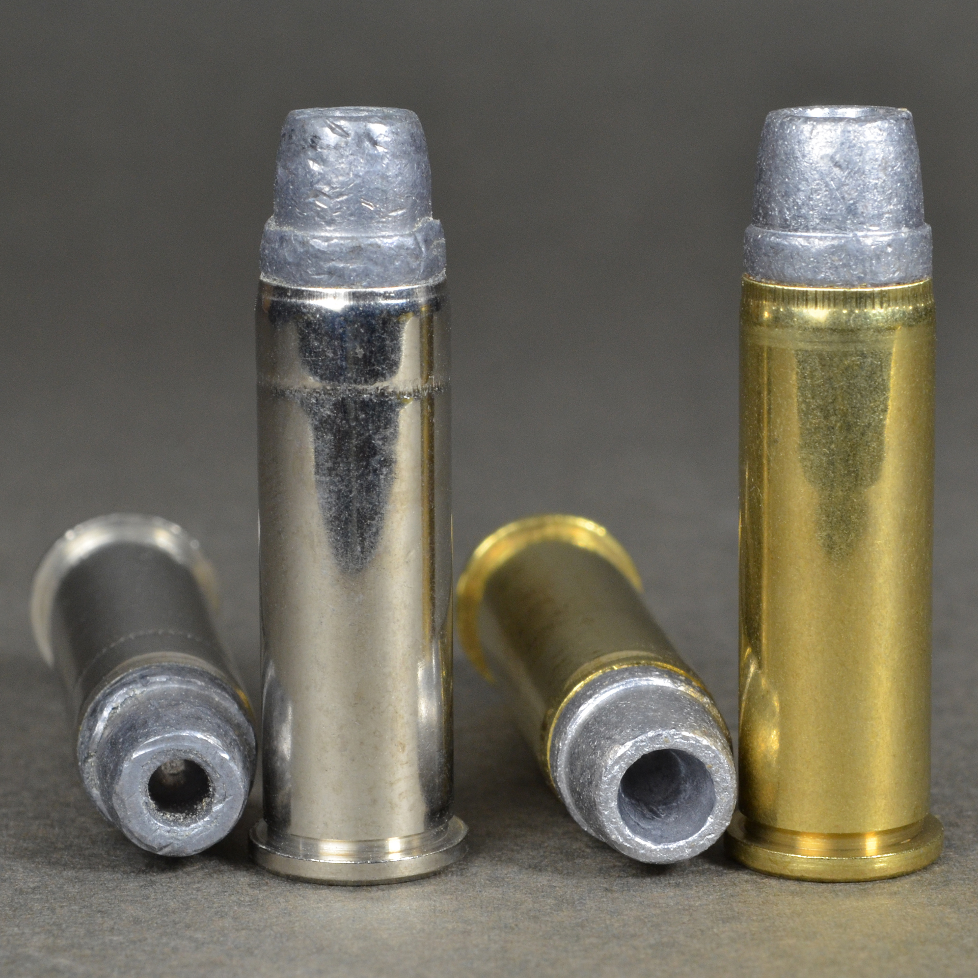 .38 Special cartridges shown vertical and bullet point hollow point brass case nickel case side-by-side comparison