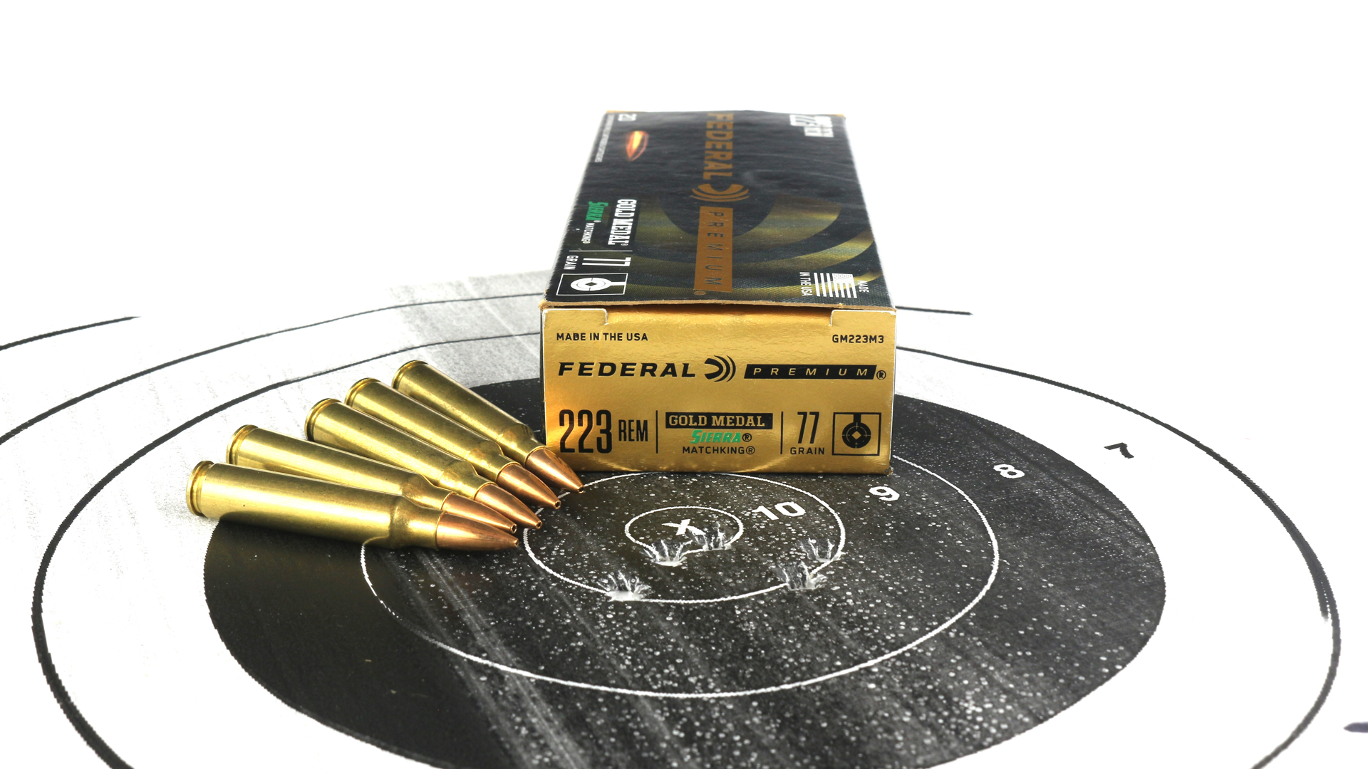 Federal Premium .223 Remington ammunition 77-grain bullets cartridges shown on black bullseye target