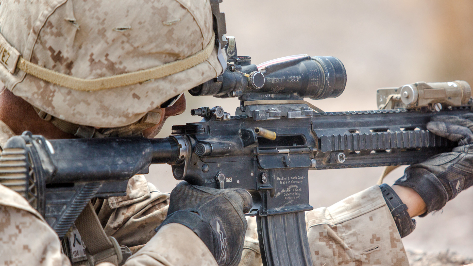 a Marine takes aim with the M27 rifle
