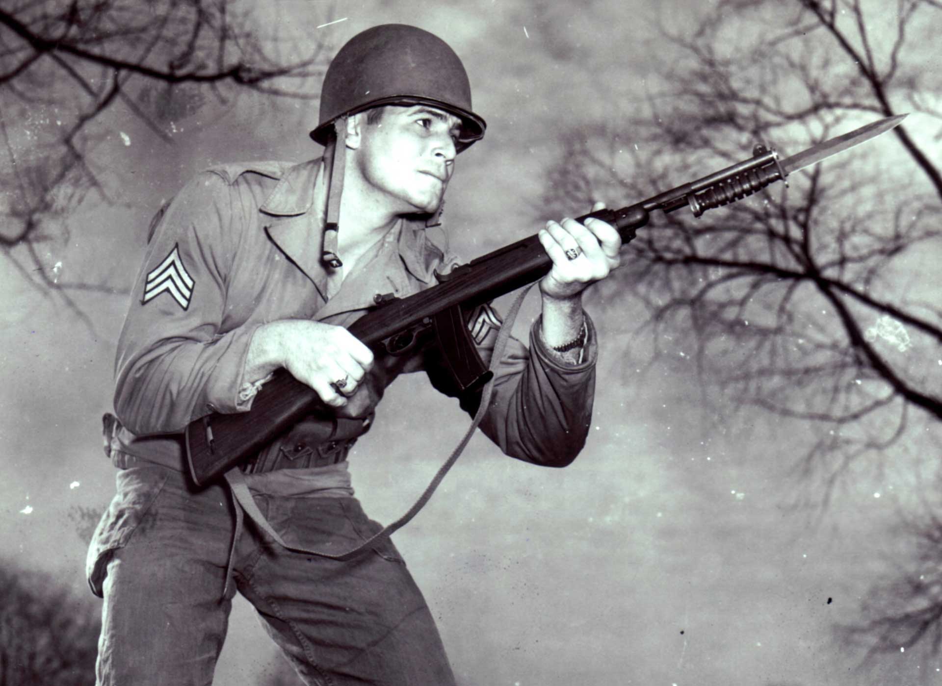 A U.S. Army soldier charges his bayonet-equipped M1 carbine.