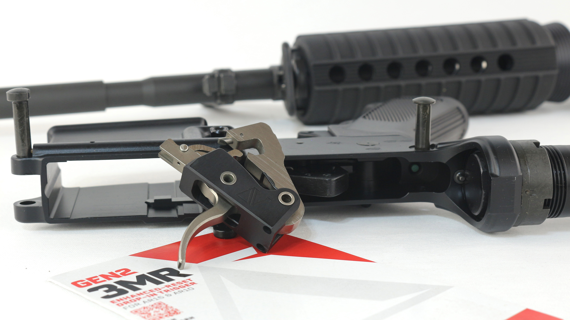 Bushmaster M4A2 Patrolman Carbine lower receiver with Gen2 3MR trigger assembly shown front and center