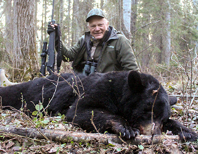 Boddington with black bear and a Mossberg Patriot in 350 Legend