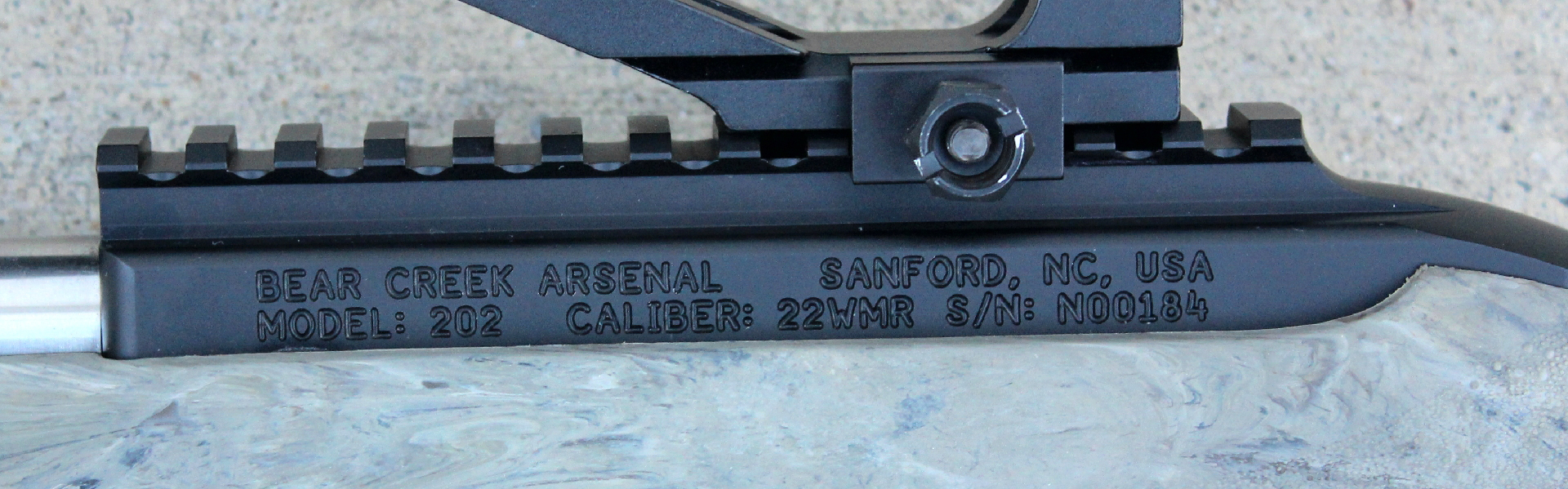 Bear Creek Arsenal BC-202 rifle receiver left-side view illustrating metal stamp marks text company information