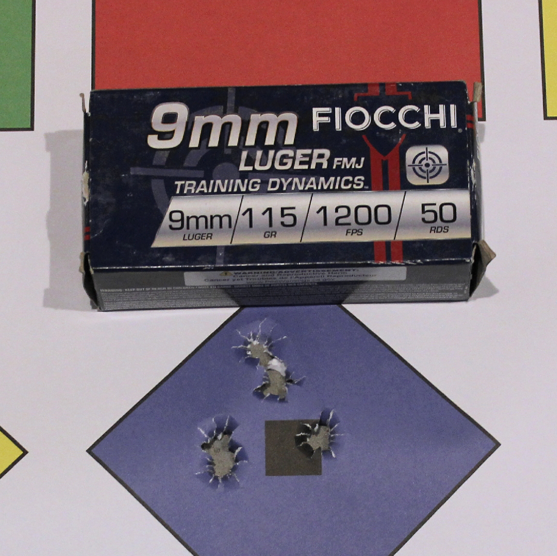 Fiocchi 9 mm Luger ammunition box shown with target accuracy group from EAA Corp Girsan Witness2311S Match pistol