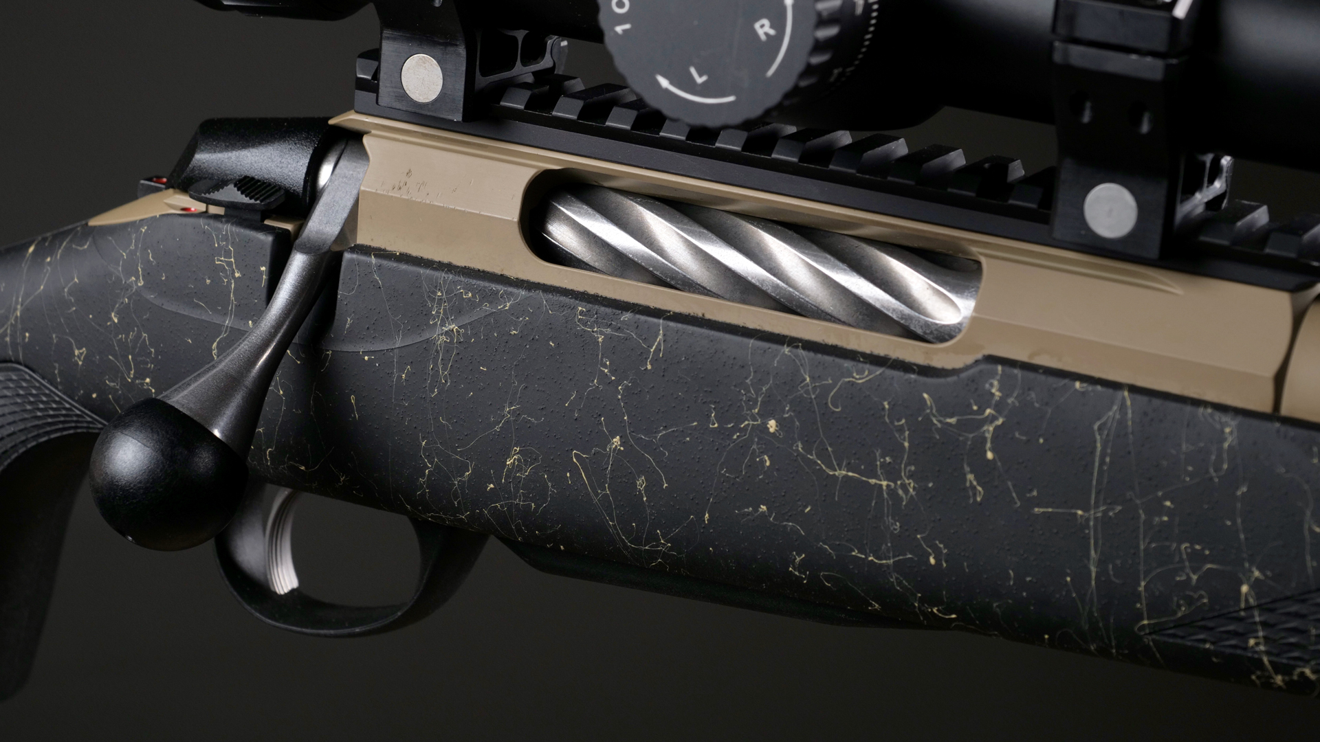 Tikka T3x RoughTech Superlite Coyote bolt-action rifle receiver closeup right-side view sprial flute bolt tan color metal black spider-web texture stock