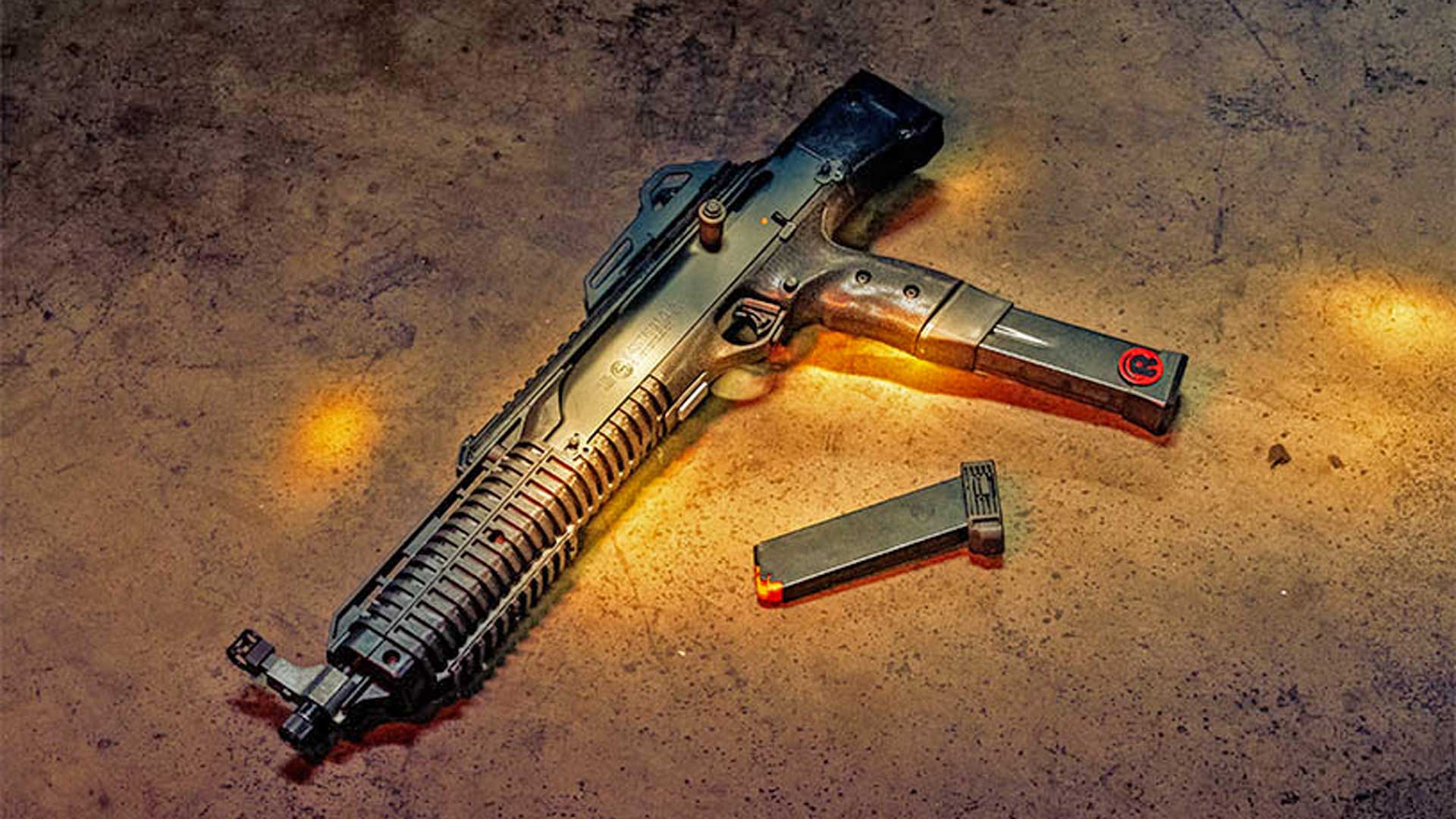 Hi Point large-format pistol left-side view shown with magazine on floor concrete