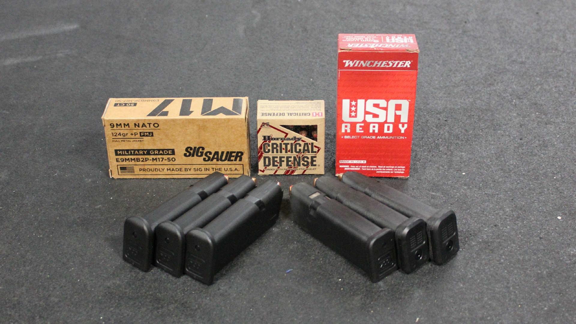 Ammunition 9 mm Luger shown with six magazines for Glock G49 Gen5 MOS three types of ammunition SIG SAUER HORNADY WINCHESTER