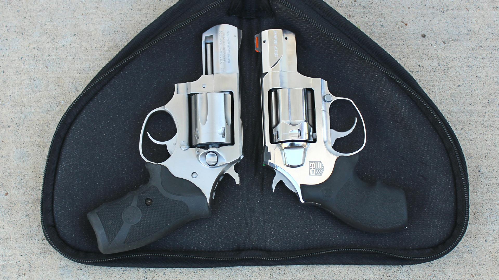 Diamondback Firearms SDR comparison versus Ruger SP101 on black zippered case side-by-side view stainless steel revolvers