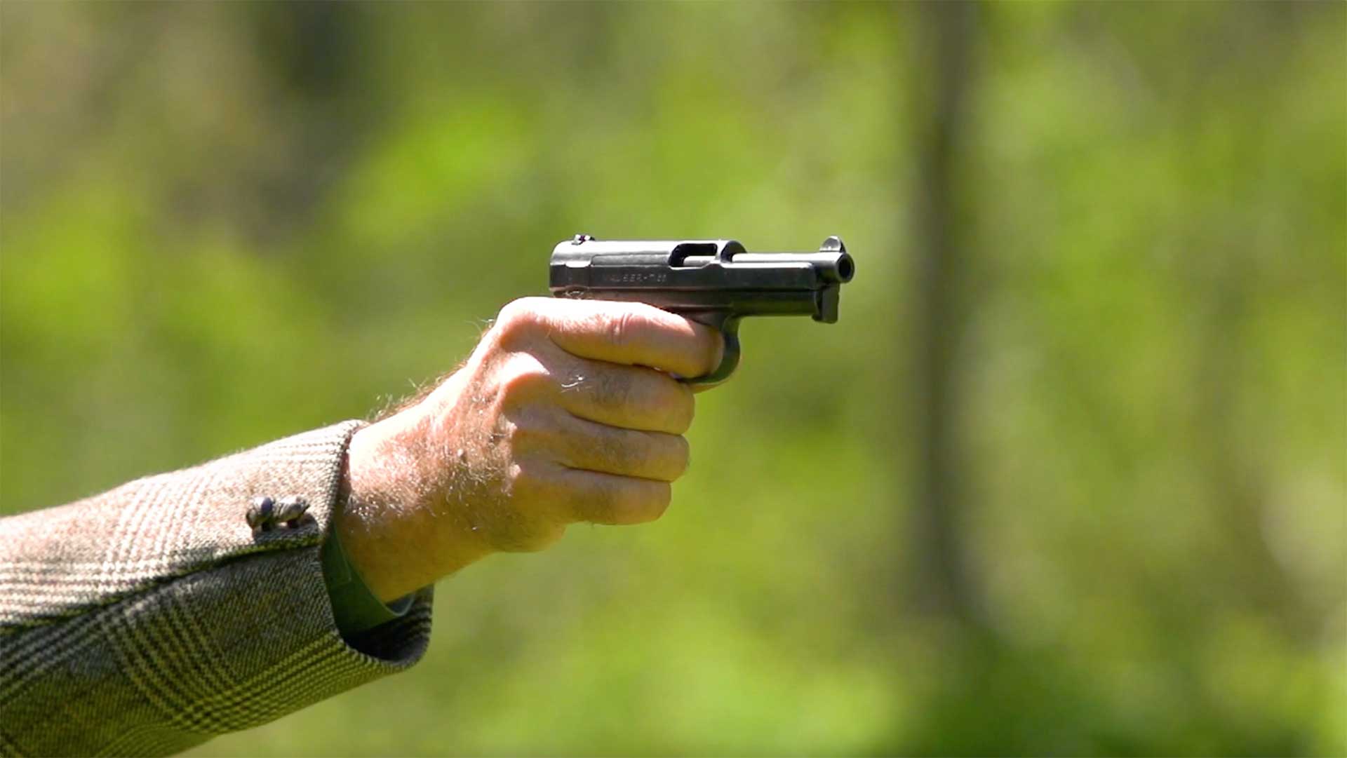 Man shooting a Mauser Model 1934 on an outdoor range.