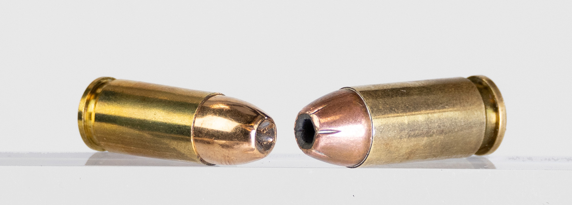 9 mm luger cartridge left next to 40 smith & wesson ammo bullets comparison