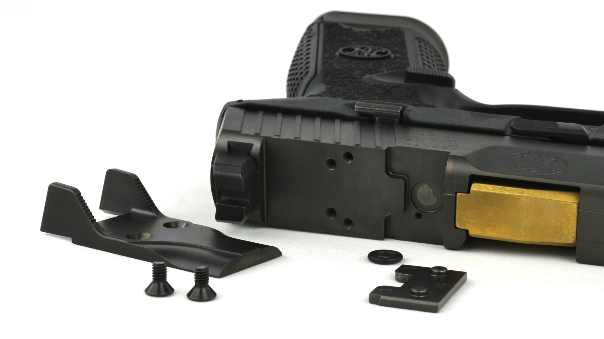 Review: FN 509 CC Edge XL on its side top-view of optic plate and parts