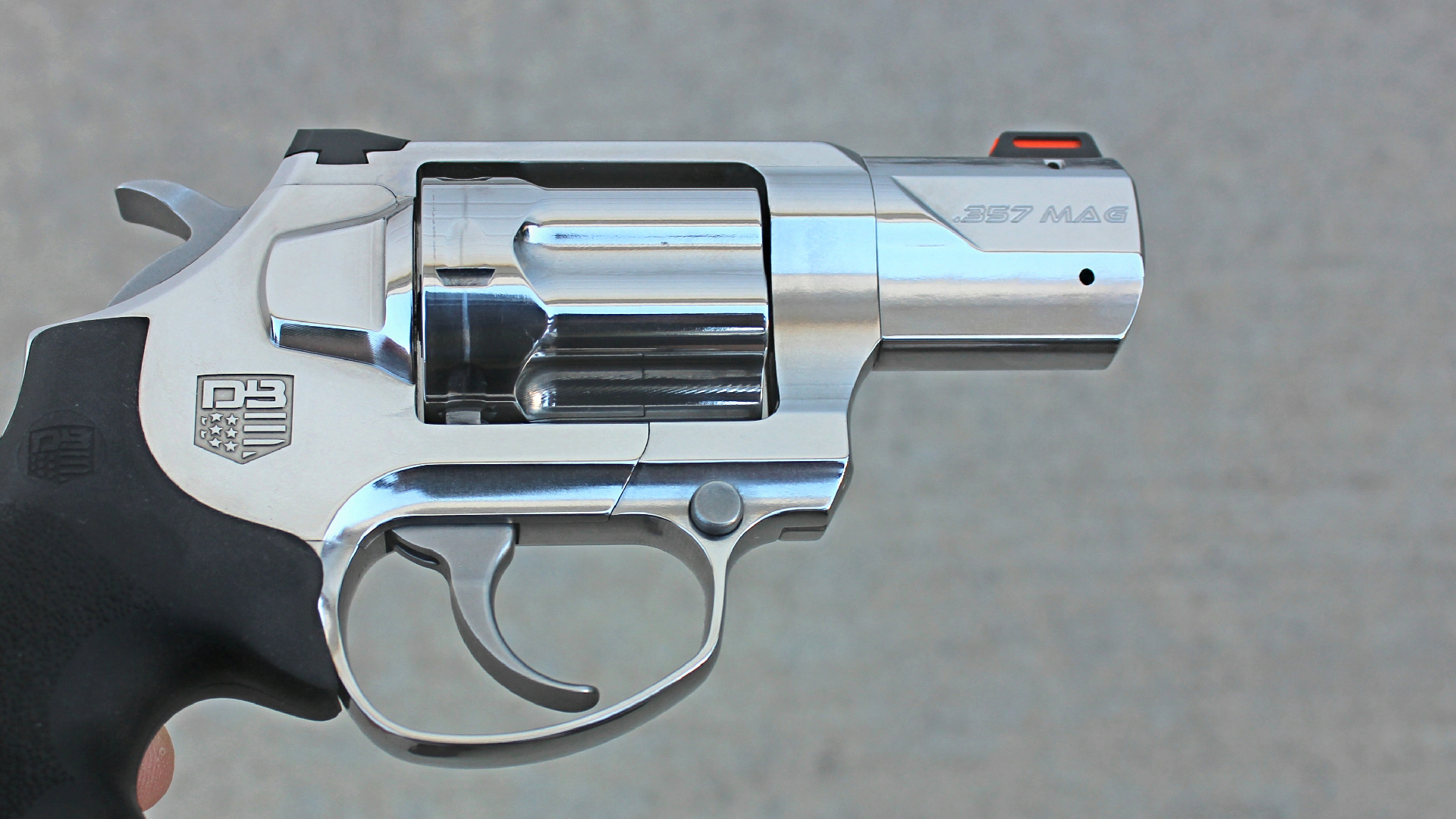 Diamondback Firearms SDR stainless steel revolver right-side view illustrating second cylinder release button forward of trigger bow