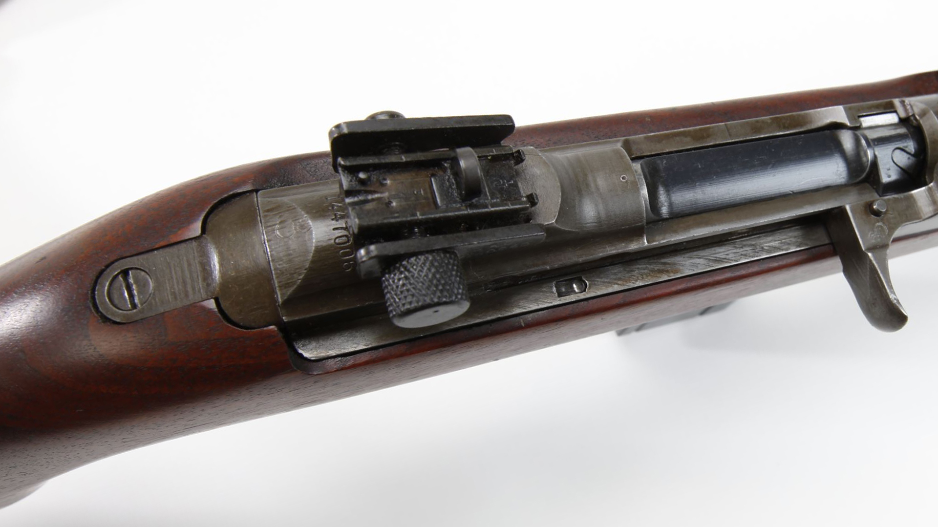 This Underwood Elliot Fisher M1 carbine in the NRA National Firearm Museum collection has the later ramped rear sight that partially obscures the serial number. On other models, the sight could obscure the serial number entirely, requiring arsenals to re-stamp the serial number elsewhere for easier visibility.