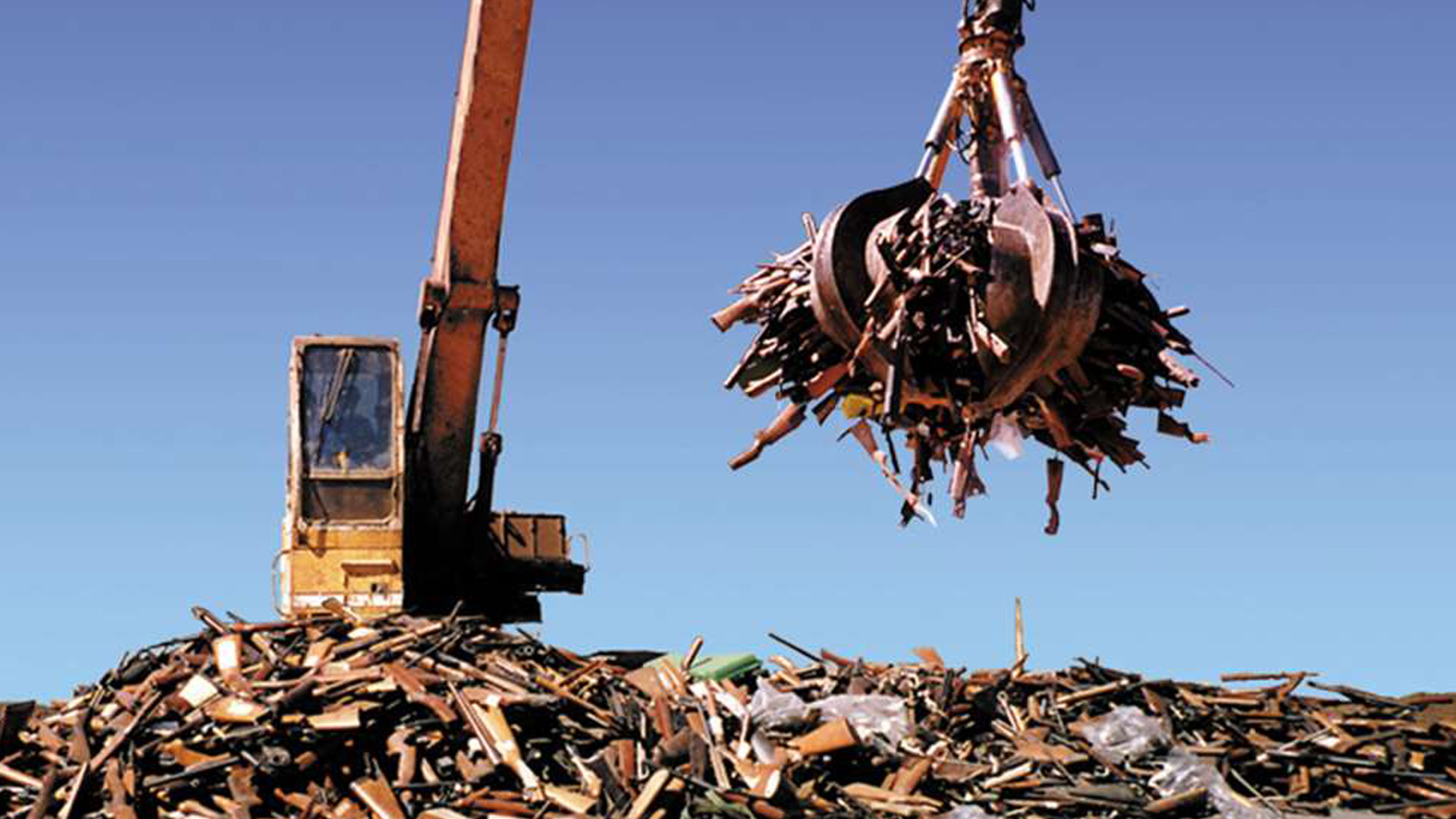 guns in trash pile