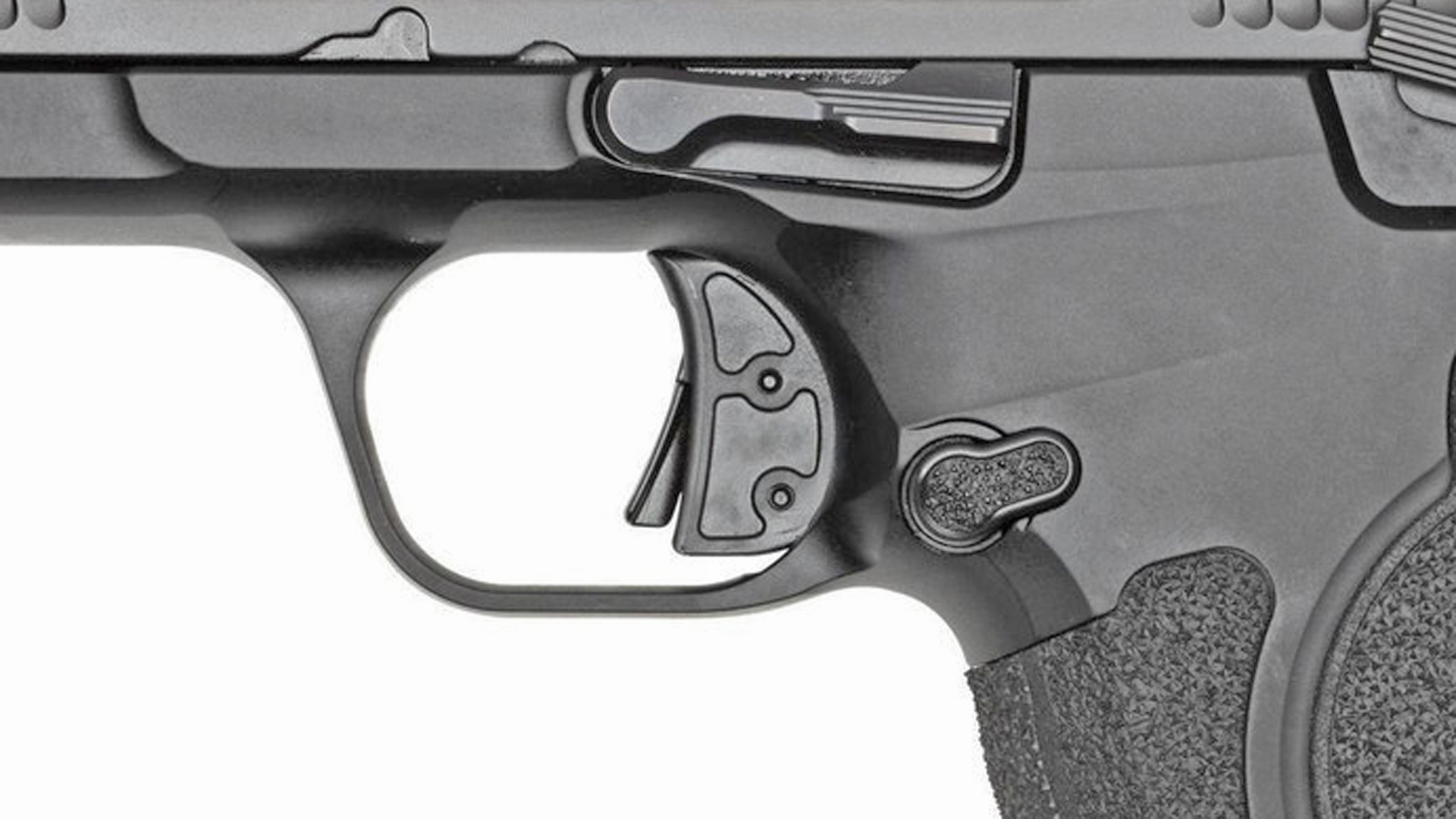 Left side of the trigger, push-button magazine release and slide stop lever on the Smith & Wesson CSX.