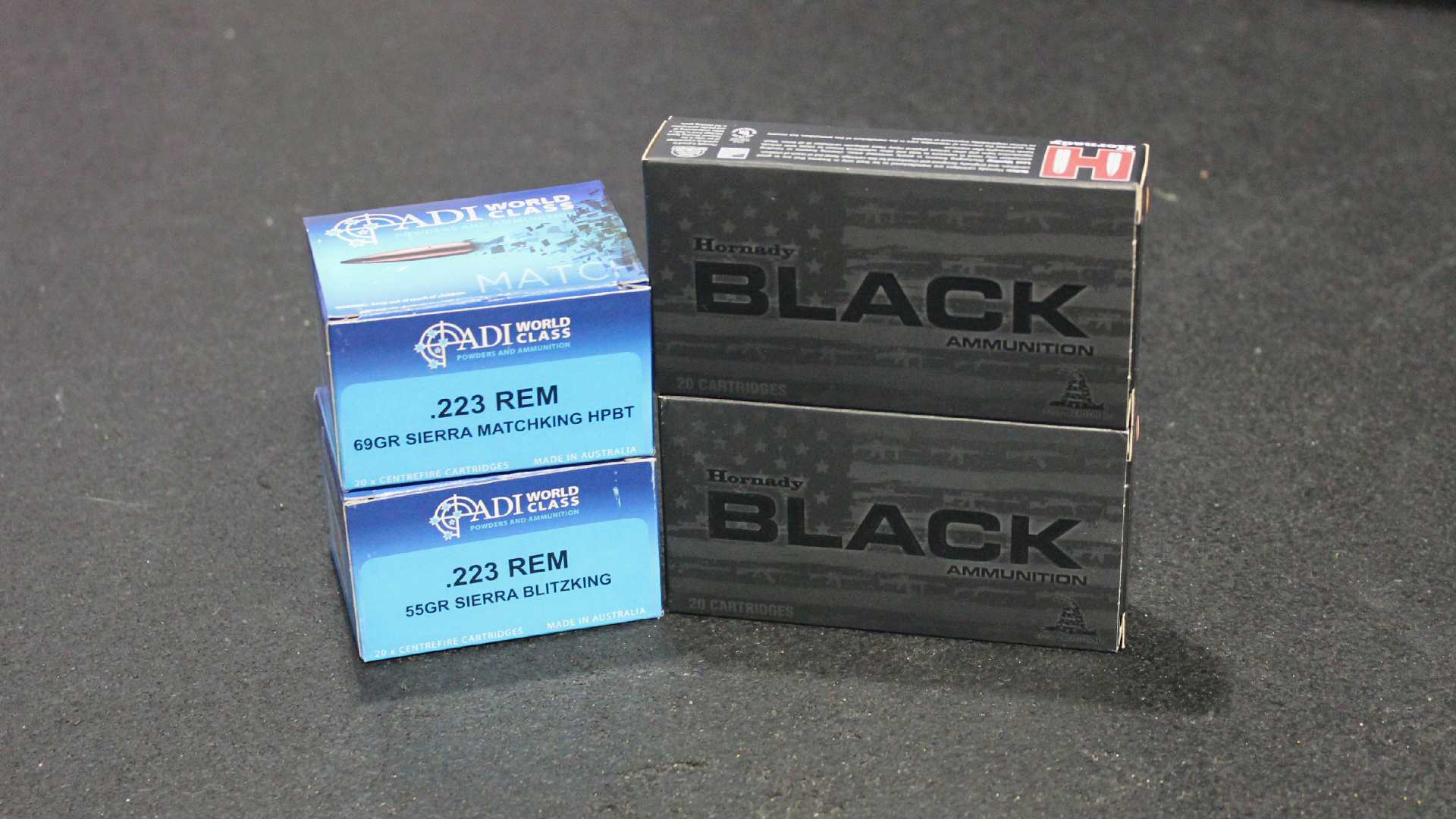 four ammunition boxes hornady black and adi world class