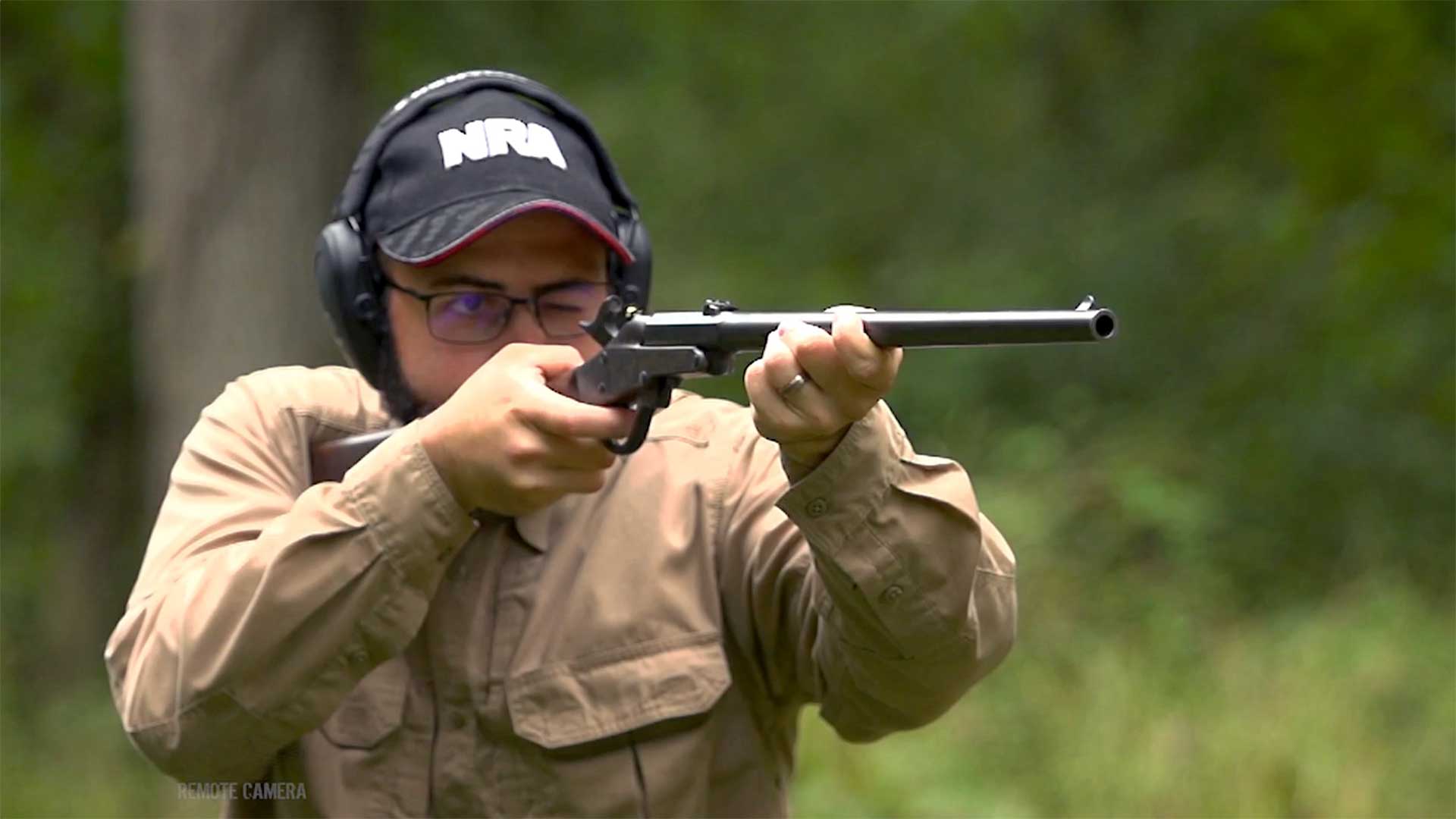 Man aiming a Maynard carbine on an outdoor range.