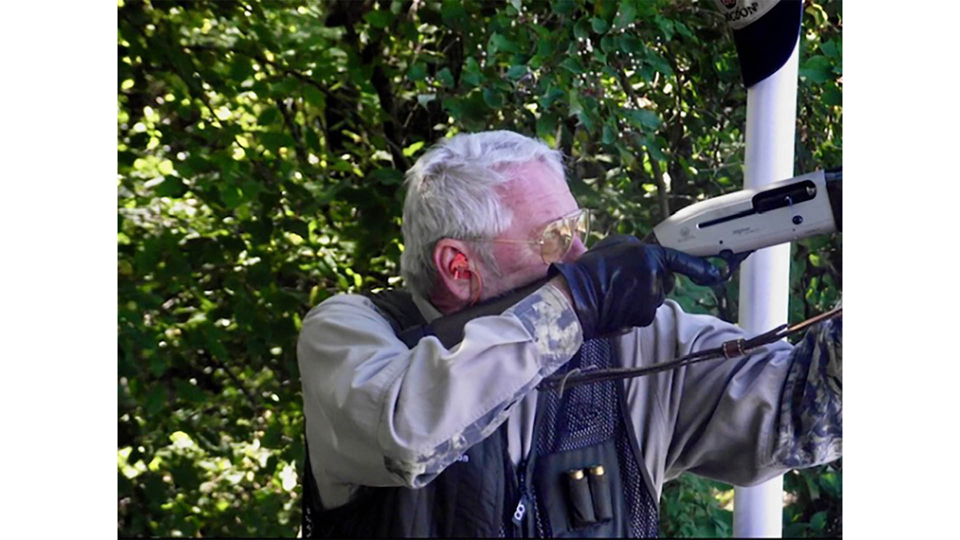 J.B. Hodgdon shooting shotgun outdoors