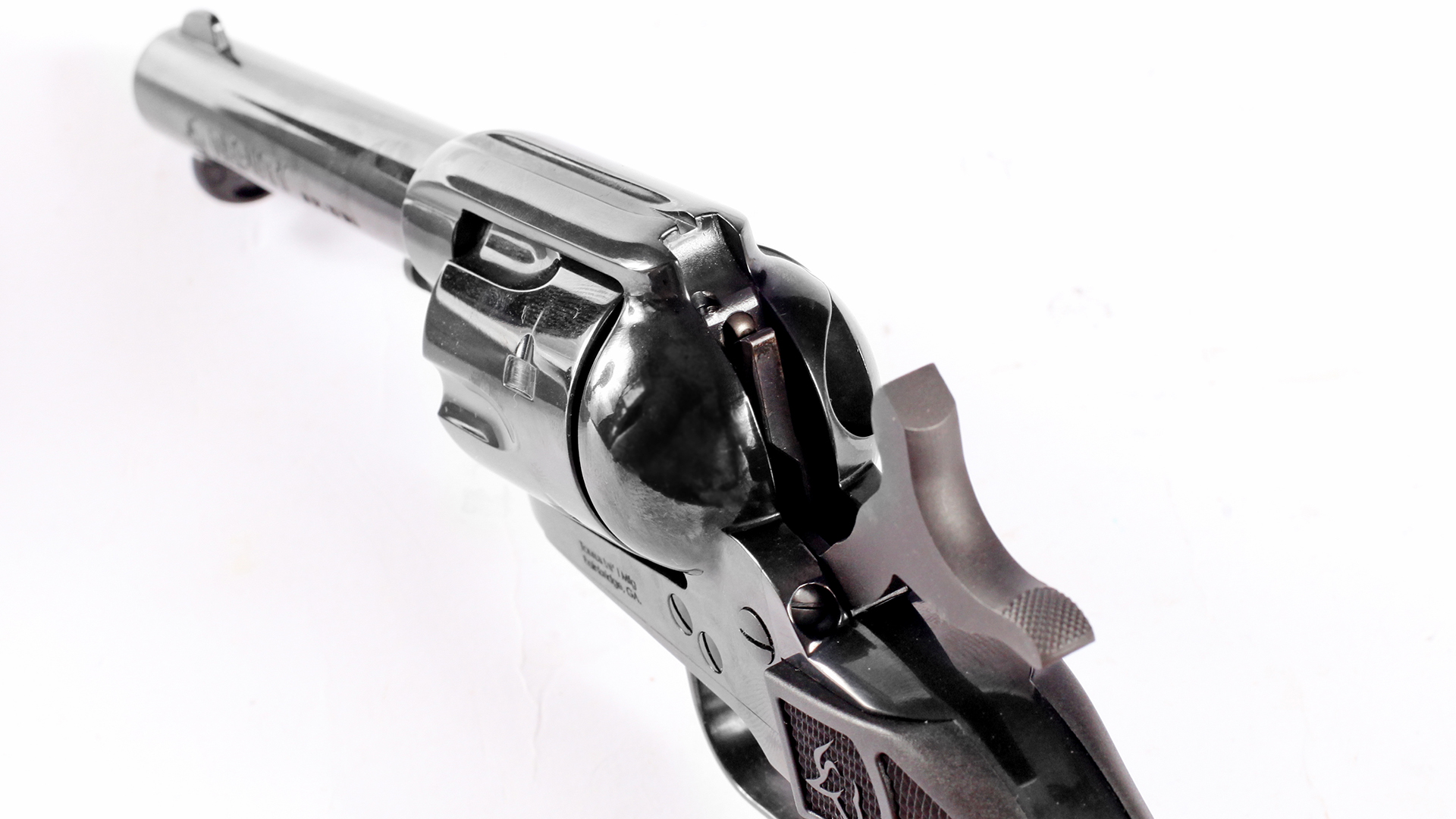 Taurus Deputy single-action revolver rear view at cocked hammer rear sight on white background