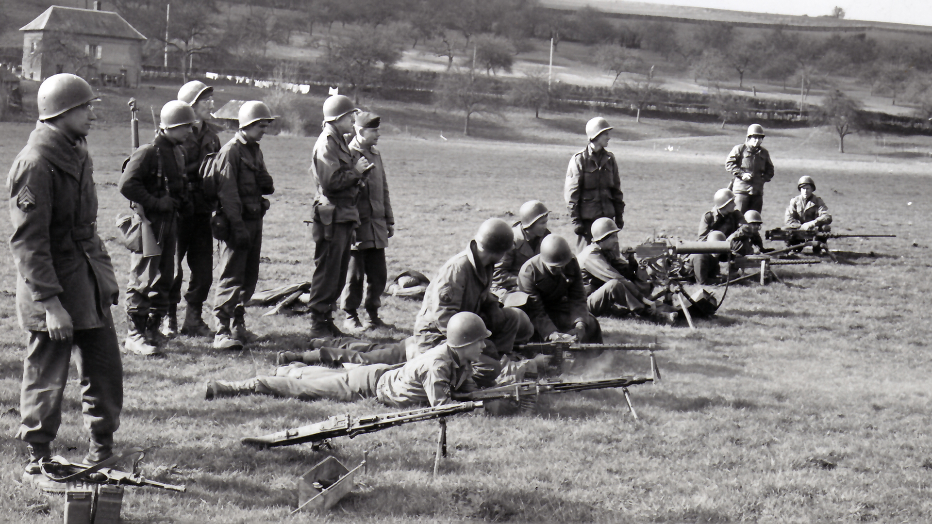 Weapons familiarization: GIs receive advanced training in comparative US and German weapons. Two MG42s, an MG34, and a MP40 SMG are test fired alongside US Browning M1919A4, M1917A1, and M2 machine guns. February 1945. Photo courtesy of National Archives and Records Administration, NARA.