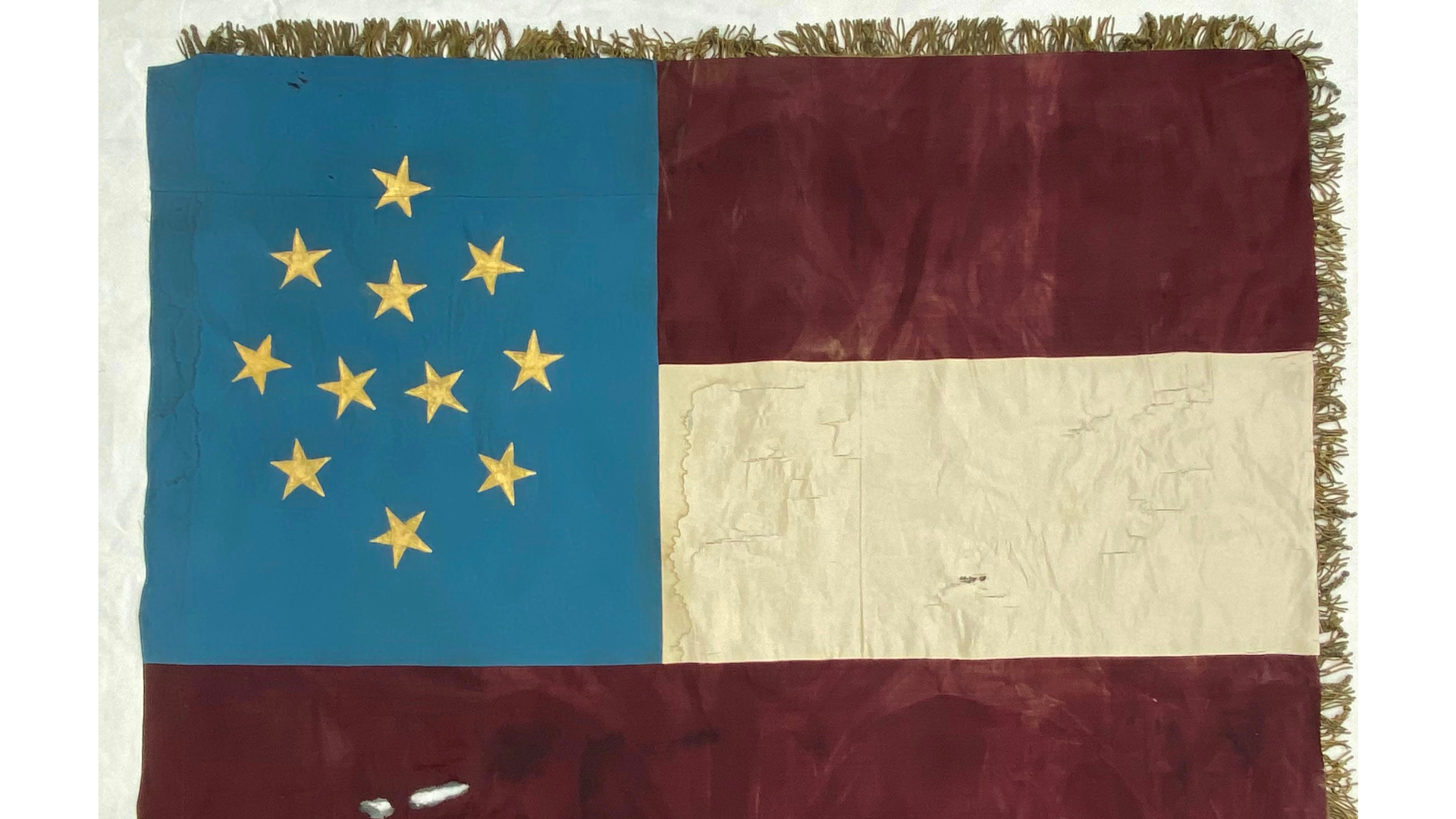 The reverse of the O’Connell Guards flag is a version of the early Confederate “First National” or “Stars and Bars” flag.  Now in an undisclosed private collection, this flag was carried until regimental colors supplanted company flags.  In June 1861, the O’Connell Guards became Company I, 17th Virginia Infantry regiment, CSA.