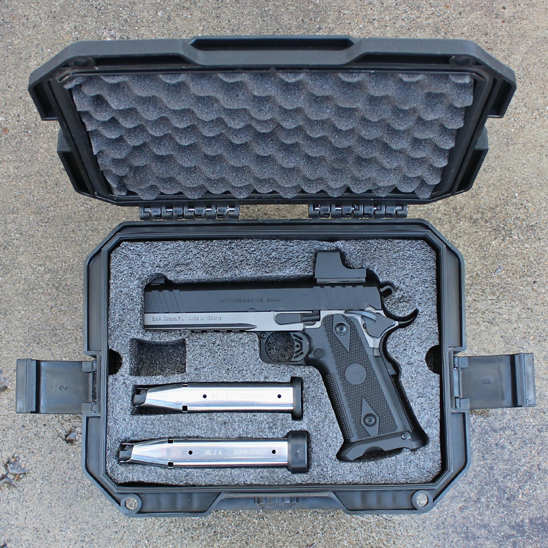 Custom molded foam insert securing eaa witness2311s match pistol and spare magazines presented left-side view