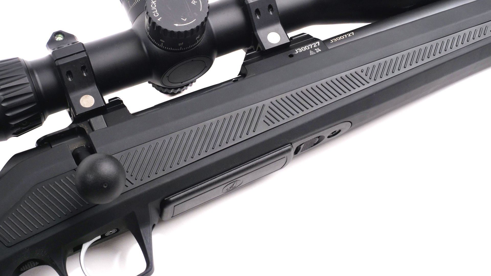 CZ 600 bolt-action rifle right-side closeup of action with bolt knob trigger magazine black stock and riflescope in view on white background