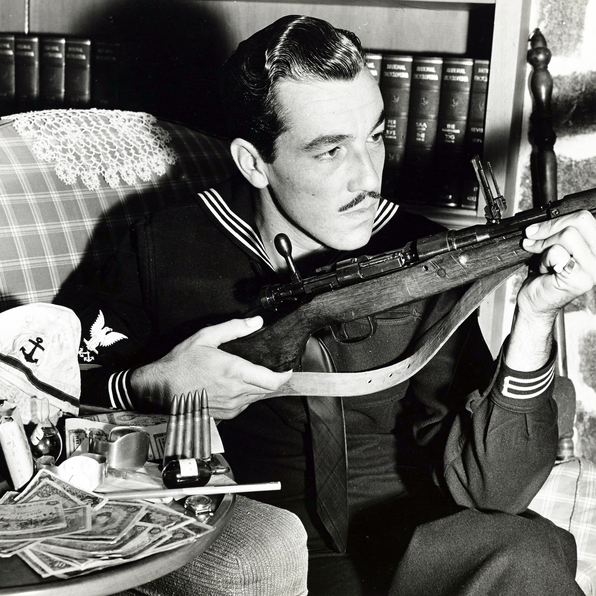 Actor Cesar Romero served with the US Coast Guard during WWII—here the original “Joker” displays a captured Arisaka rifle that he brought home in late 1944.