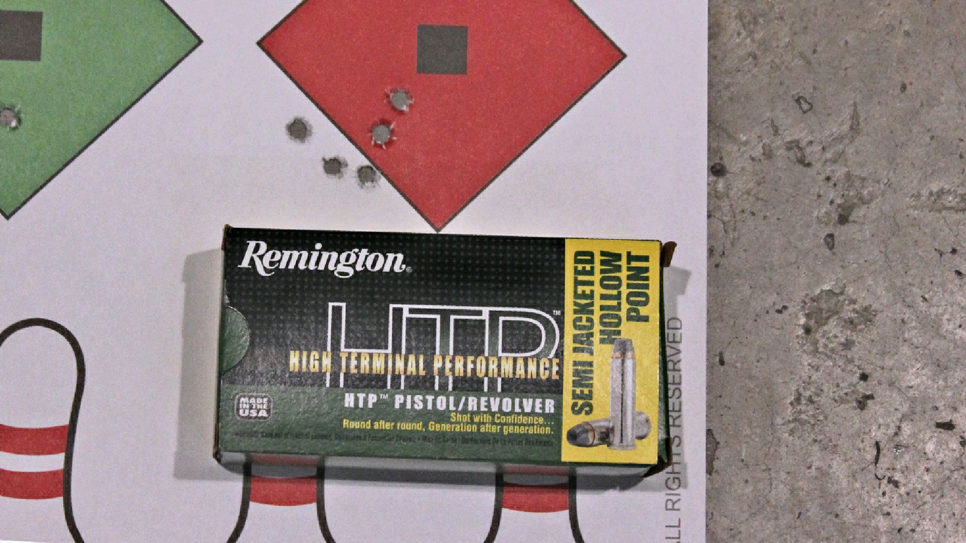 Remington High Terminal Performance ammunition box shown with target accuracy grouping